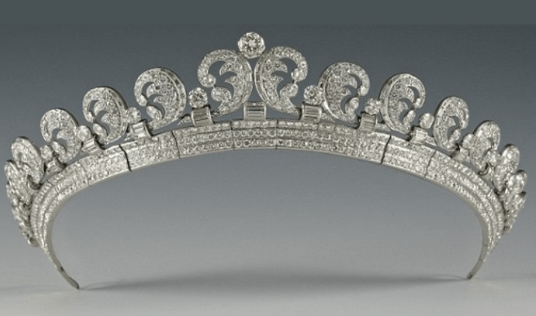 A detailed tiara made by Cartier in 1936, featuring 16 graduated scrolls adorned with 739 brilliant-cut diamonds and 149 baton diamonds, showcasing intricate design and luxury.